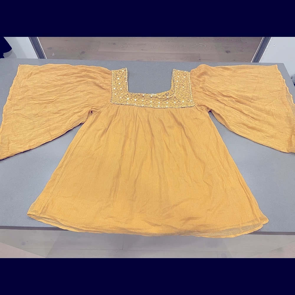 Free minds Peasant top with butterfly sleeves.